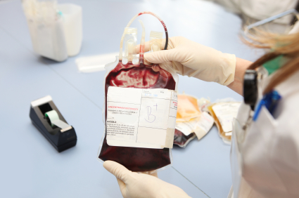 Doctor holding blood bag